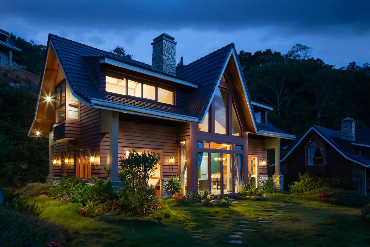Family house lit up at dusk, available for rent